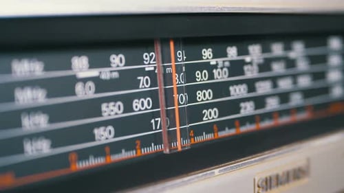 Tuning Analog Radio Dial Frequency on Scale of the Vintage Receiver