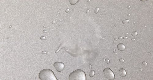 Abstract water drops on grey silver background, macro