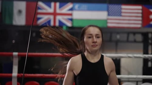 Woman Jumps Rope in Boxing Ring for Fitness