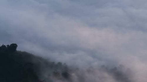 Scenic Mountain Range Covered in Fog