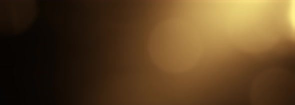 Gold Yellow Bokeh Particles Background