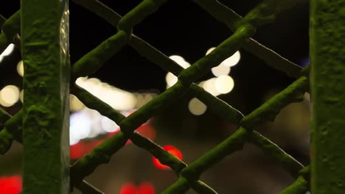 View Through The Bars At The Moving City Lights, Night, Time Lapse
