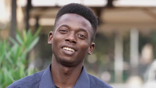 Smiling Young Man Portrait Close-Up Outdoors
