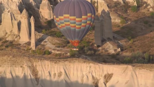 Hot Air Ballooning Over Desert Landscape