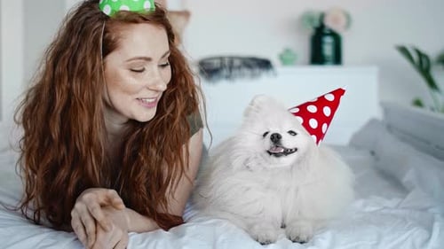 Woman Celebrates Birthday with Adorable Dog at Home