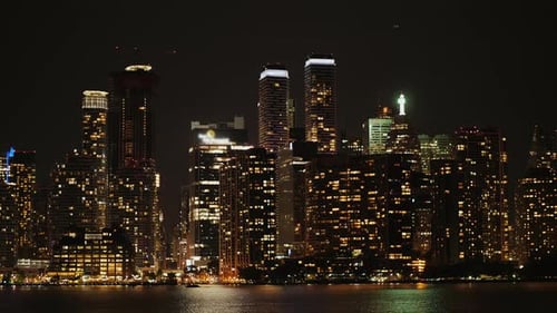 Night City - Glowing Skyscrapers Are Reflected in the Water