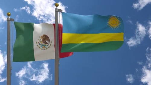 Realistic Waving Flags of Mexico and Rwanda Against Blue Sky