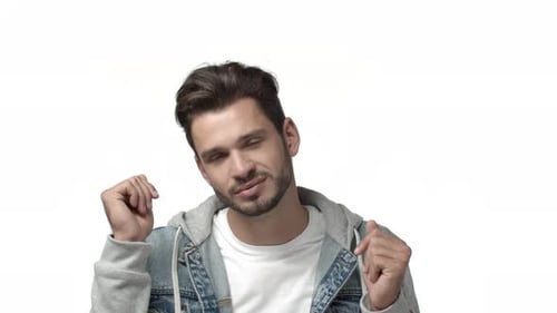 Attractive Man Dancing and Smiling on White Background