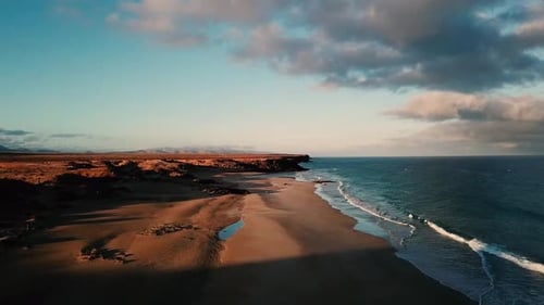 Aerial view of beautiful coast line with beach and colored blue ocean. Concept of vacation travel