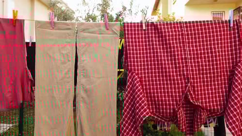 Clothes Hanging on Clothesline in Backyard