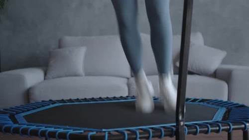 Woman Exercising on Mini Trampoline at Home