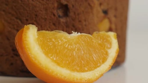 Slice of orange and Italian cake called panettone 4K video