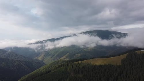 Aerial View of Green Mountains with Clouds
