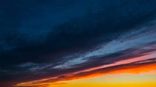 Dramatic Sky at Sunrise or Sunset with Clouds