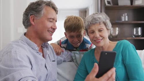 Family Watching Phone Indoors