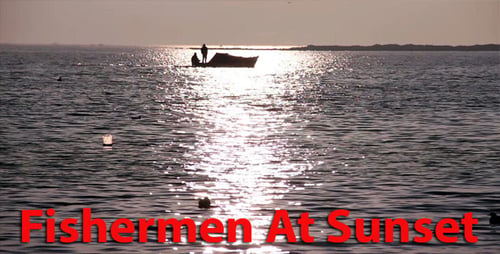 Fishermen Sailing on Sea During Golden Hour
