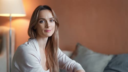 Attractive Woman Smiling in Comfortable Indoor Setting