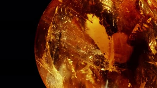 Amber. Beautiful Colored Pieces of Amber. Amber Texture. Red-yellow Amber with Bubbles, Waves