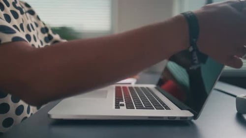 Woman Meditating at Desk After Closing Laptop