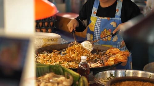 Chef Cooking Noodles and Shrimp