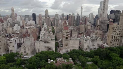 Aerial view of high-rise in Lenox Hill and the Central park in cloudy Manhattan, NYC, USA - reverse,