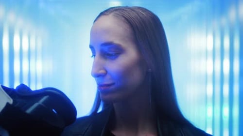 A Beautiful Young Girl Puts on Virtual Reality Glasses on Her Head