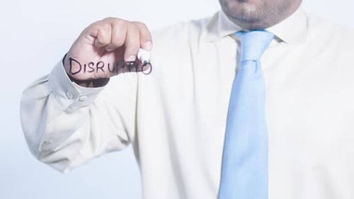 Asian Businessman Writes Disruption