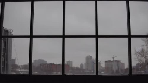 Businessman and Business Woman Meet in the Office Near the Window and Discuss the Project.