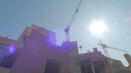 Construction Site with Cranes Building New Structure