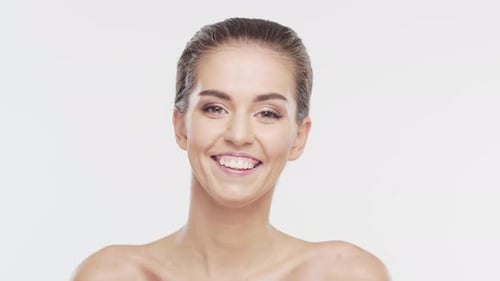 Young Woman Smiling in a Close Up Portrait