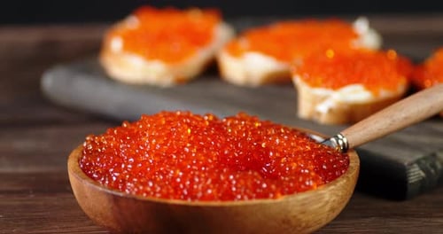 Caviar Close Up with Sandwiches on Table