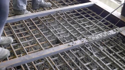 Workers and Engineers Pour Foundation. Tons of Concrete and Reinforcement Form a Solid Monolithic