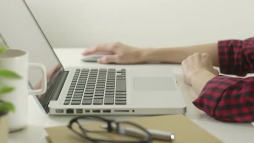 Woman Using Computer And Mouse