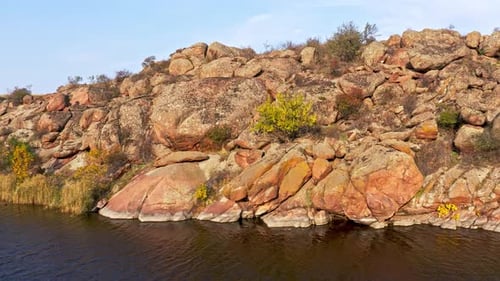 A Smooth Shining Stream Flows Among Large Boulders
