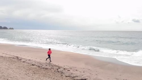 Woman running on beach