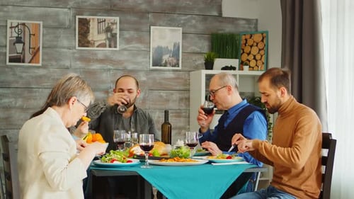 Family Toasting at Dining Table Celebration Together