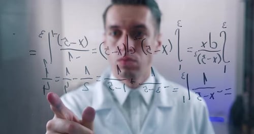 Man Writes Math Formulas on Transparent Surface