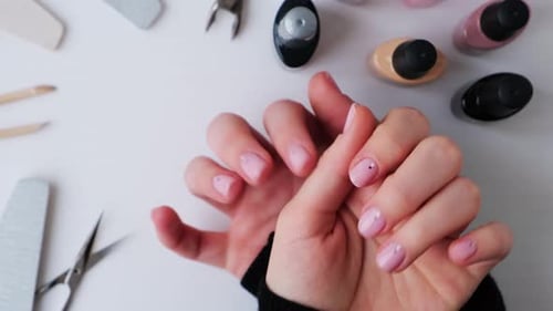 Woman's Hands Displaying Nail Art in a Salon