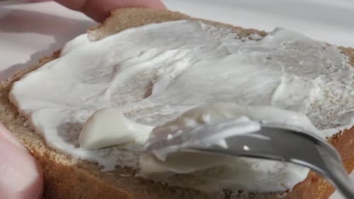 Cream Cheese Spread on Bread with Spoon