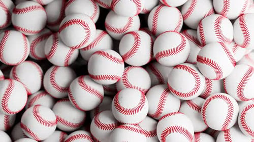 A large number of white baseball balls. Set of many professional sports balls.