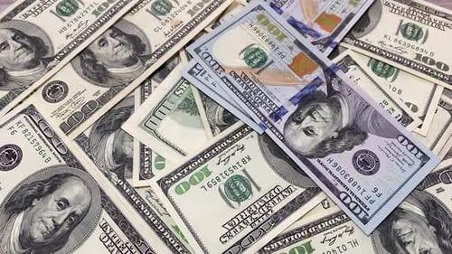 Money Falling on a lot of money. 100 usd bills