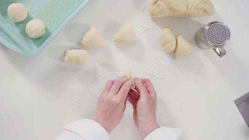Dough Being Prepared on a White Table