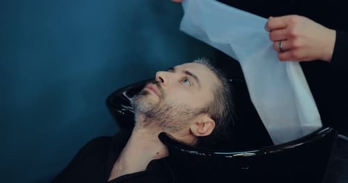 Man Having Hair Washed and Dried at Salon