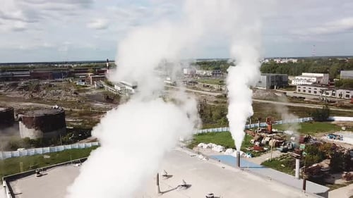 Aerial view of smoke coming out of chimneys