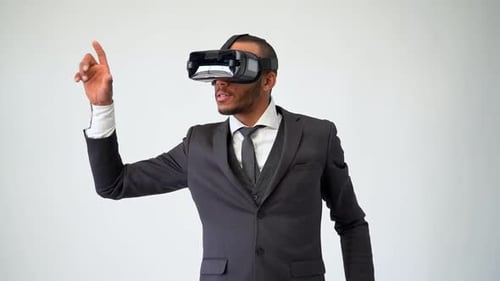 Young Adult Using VR Headset in Gray Suit