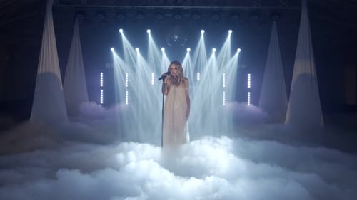 Elegant Woman Singing on Stage in Fog