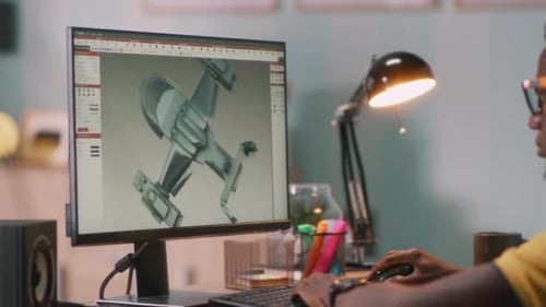 Black Man Browsing 3D Model on Computer