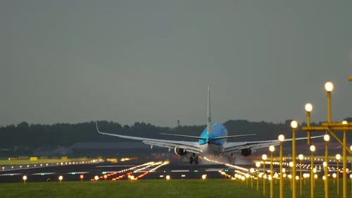 Airplane Landing with Smoke From the Landing Gear