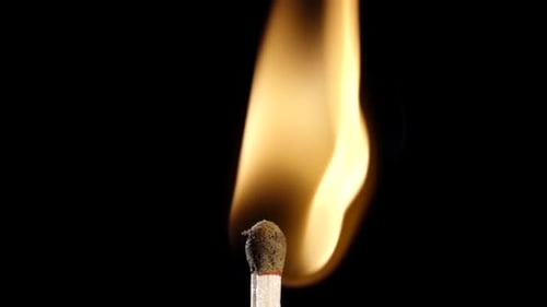 Match Ignites and Burns in Striking Close Up