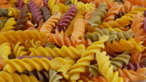 Close Up of Multicolored Uncooked Spiral Pasta